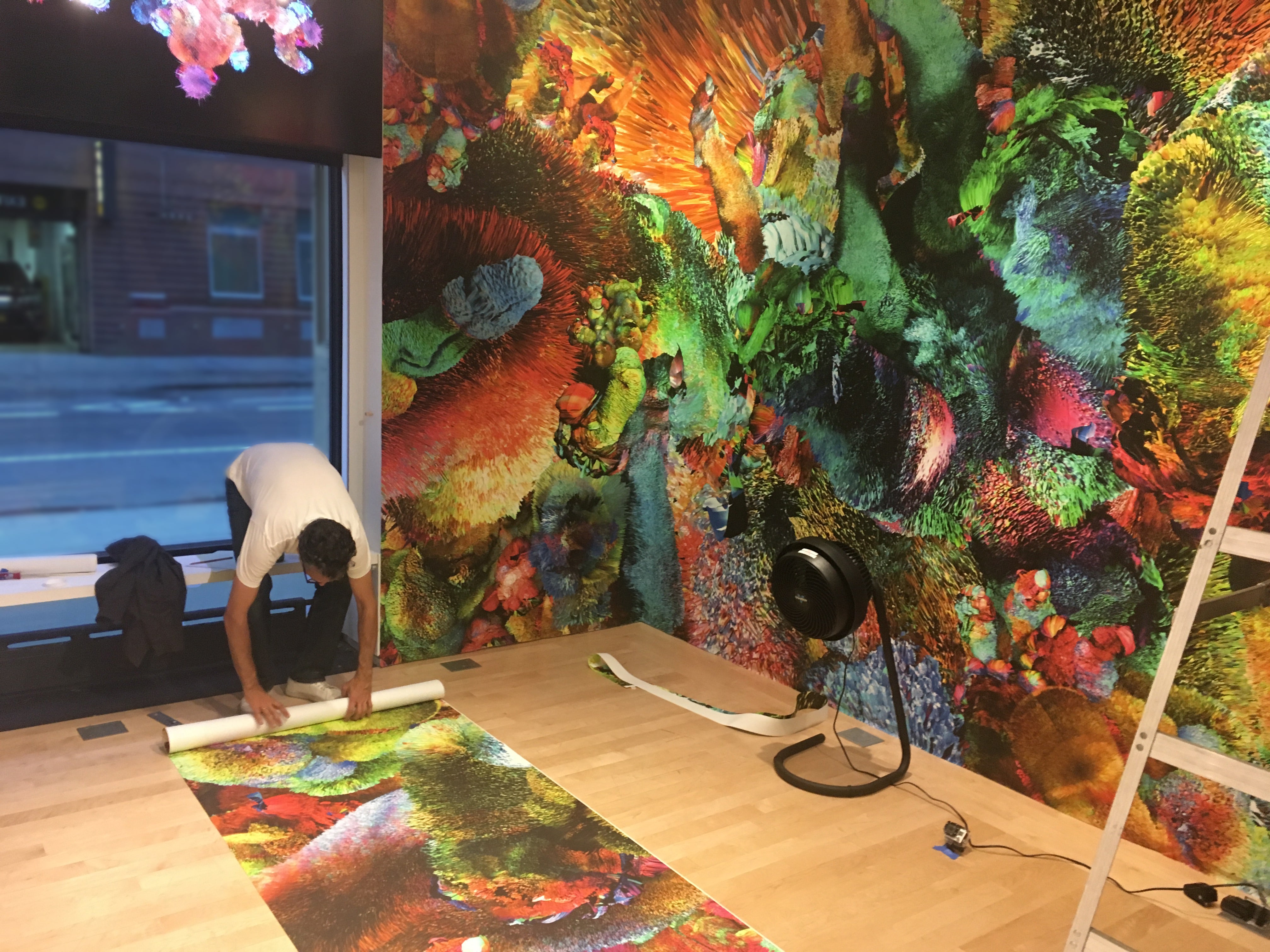 Installation shot of Jose Carlos Casado installing Kodak Repositionable Material for solo exhibition
